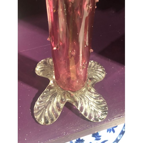 503 - Cranberry glass thorn vase on clear foot.