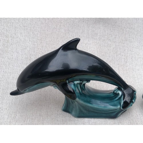 602 - Pair of small dolphins on waves by Poole pottery