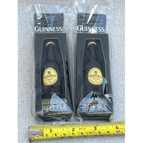 694 - 2 x Miniature Guinness bottles in boxes and packaging