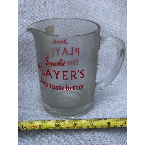 725 - Player’s They taste better glass jug.