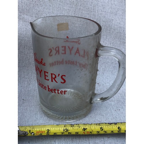 725 - Player’s They taste better glass jug.