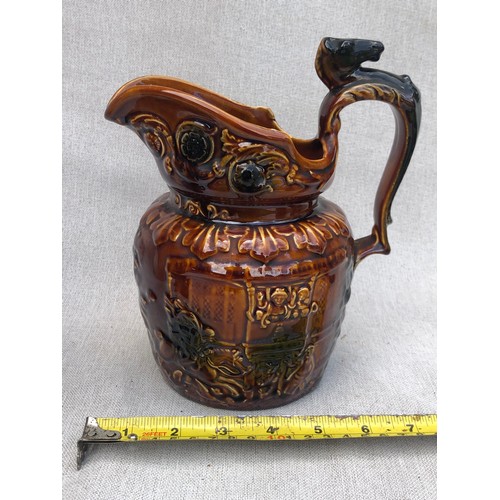 740 - Arthur Woods John Gilpin Horse Head Pitcher treacle glazed relief pattern jug with horse head handle... 