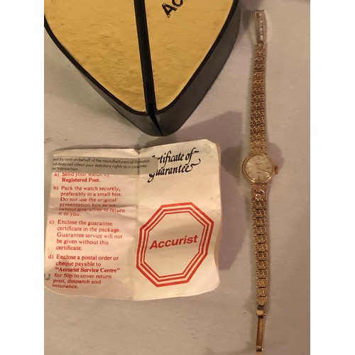 129 - Solid 9ct gold ladies Accurist dress watch. With heart shaped box and certificate