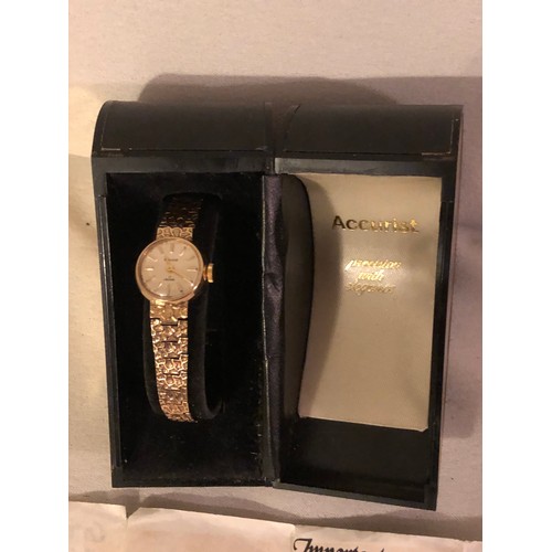 129 - Solid 9ct gold ladies Accurist dress watch. With heart shaped box and certificate