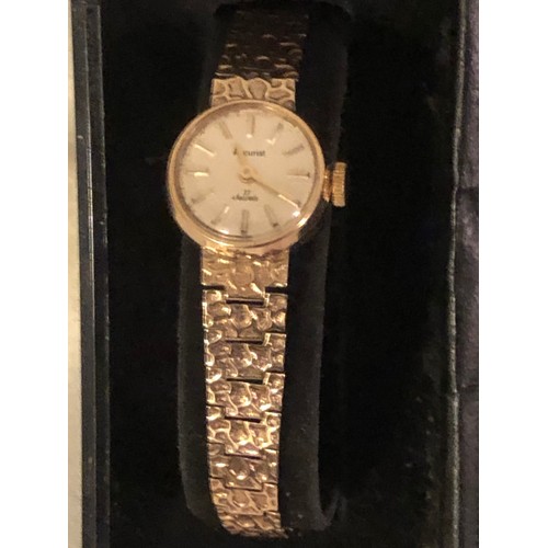 129 - Solid 9ct gold ladies Accurist dress watch. With heart shaped box and certificate