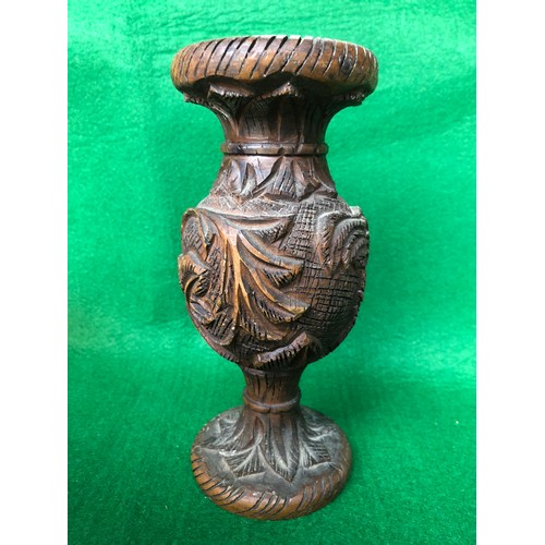 192 - Wooden tribal art vase decorated with carved camel and palm trees.