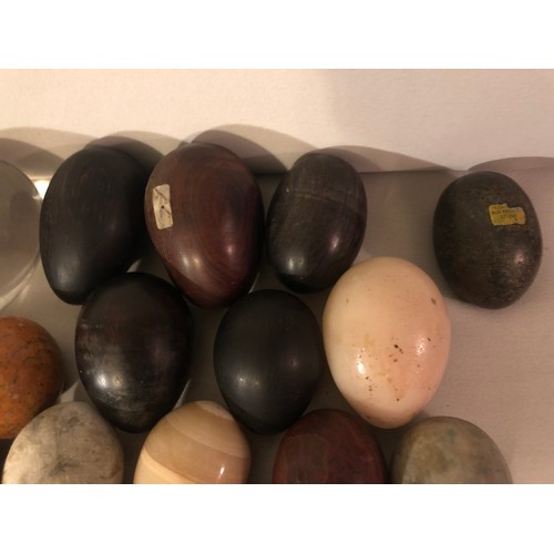 321 - A good collection of rock minera, glass and wooden eggs