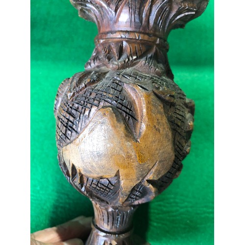 182 - Wooden tribal art vase decorated with carved camel and palm trees.