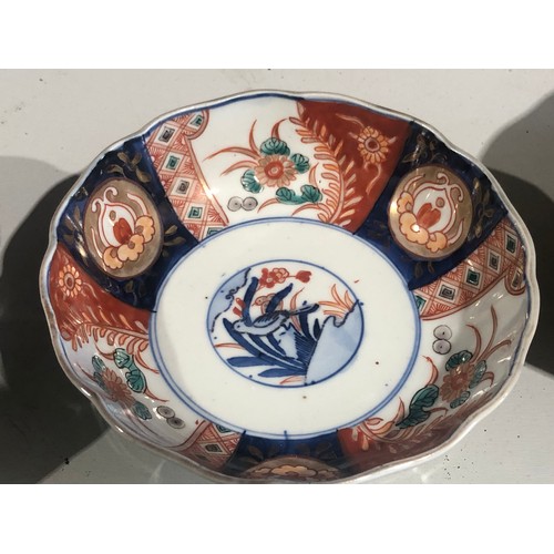 368 - Pair of oriental dishes with blue circle rims