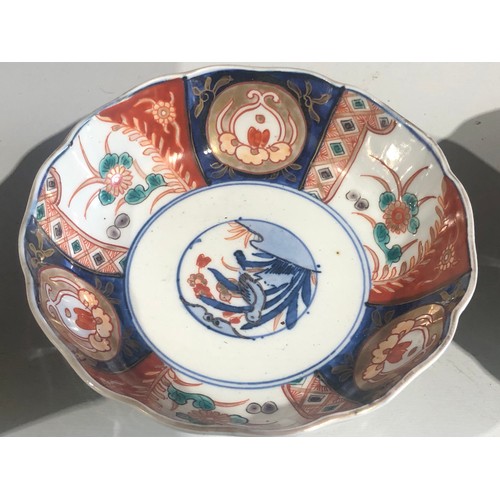 368 - Pair of oriental dishes with blue circle rims