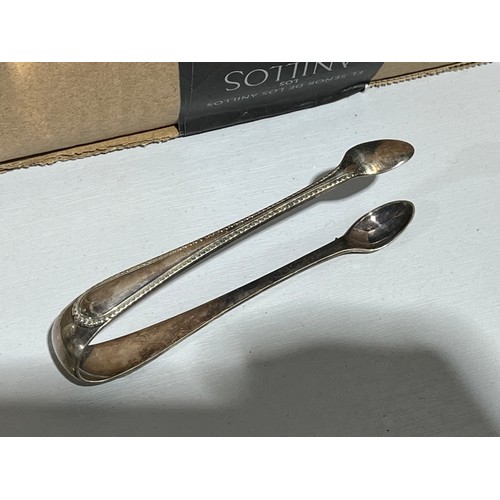 879 - Plated silver A1 sugar tongs with old Shefield plate marks