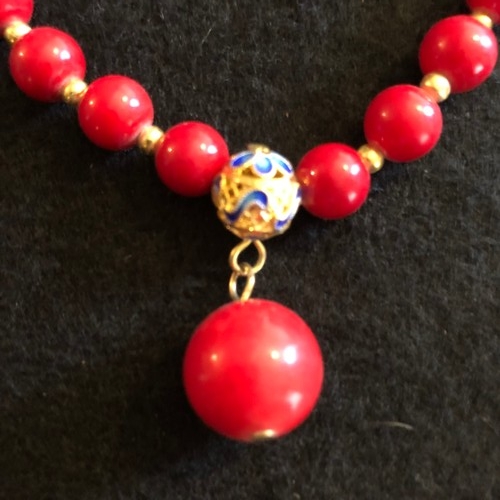 6 - a red coral beaded necklace with gold colour spacers and enamel clasp