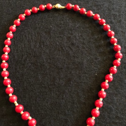 6 - a red coral beaded necklace with gold colour spacers and enamel clasp