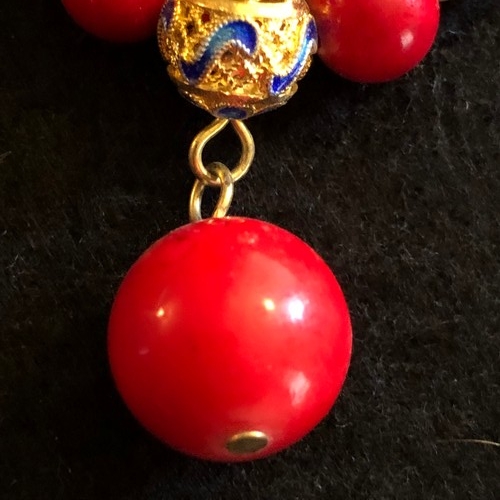 6 - a red coral beaded necklace with gold colour spacers and enamel clasp