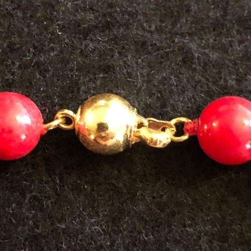 6 - a red coral beaded necklace with gold colour spacers and enamel clasp