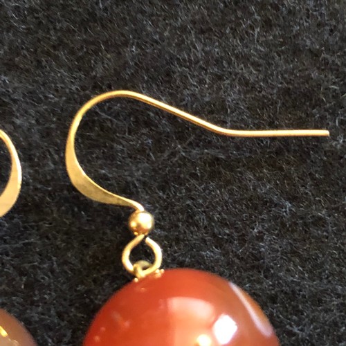 7 - a pair of large red bead earrings