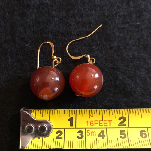 7 - a pair of large red bead earrings