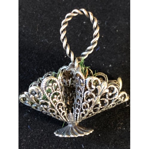 39 - White metal filigree basket brooch. Not assayed