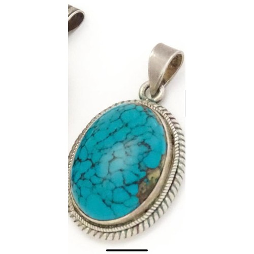 275 - Silver pendant with Turquoise center stone
