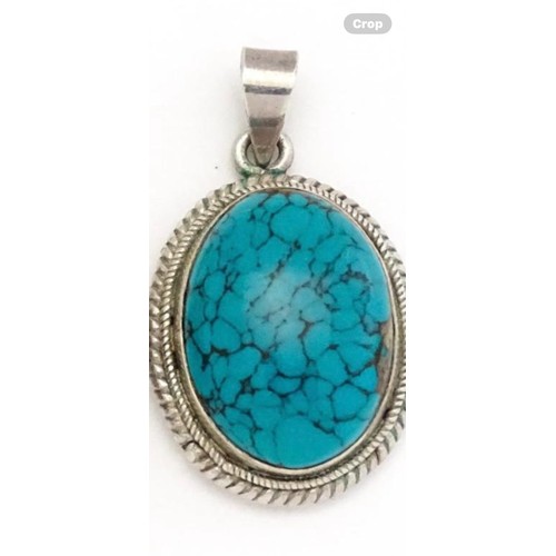 275 - Silver pendant with Turquoise center stone