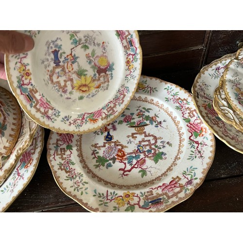 Antique dinnerware in Chinese Tree pattern. Various chips and silver ...