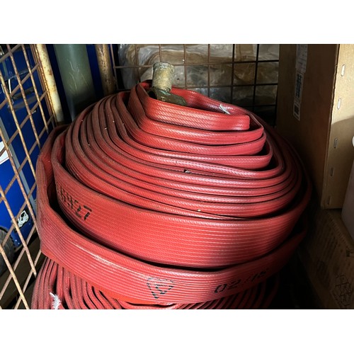 148 - Fire hose with brass end attachments.