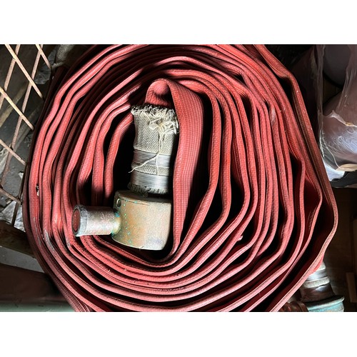 148 - Fire hose with brass end attachments.