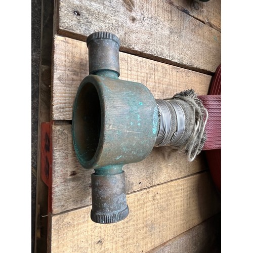 148 - Fire hose with brass end attachments.