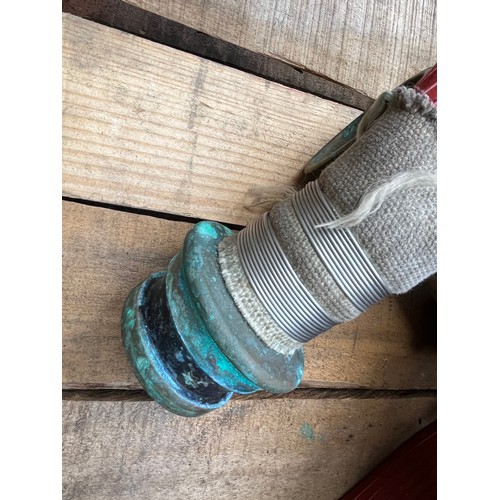 148 - Fire hose with brass end attachments.