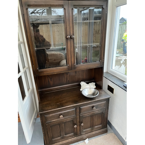 484 - Pair of glazed cabinets with drawers under