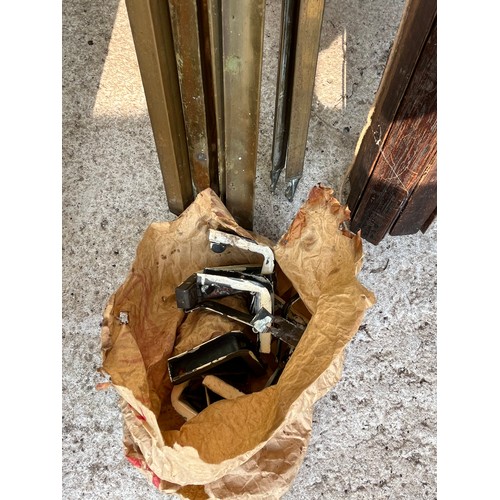 510 - Quantity of wood and brass stair rods with some clamps