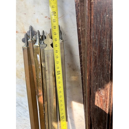 510 - Quantity of wood and brass stair rods with some clamps