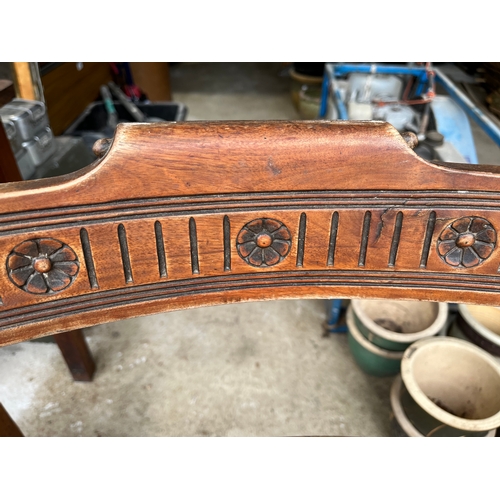 535 - Set of 4 rare Georgian carved chairs with front wheels and spring seats covered with leather.