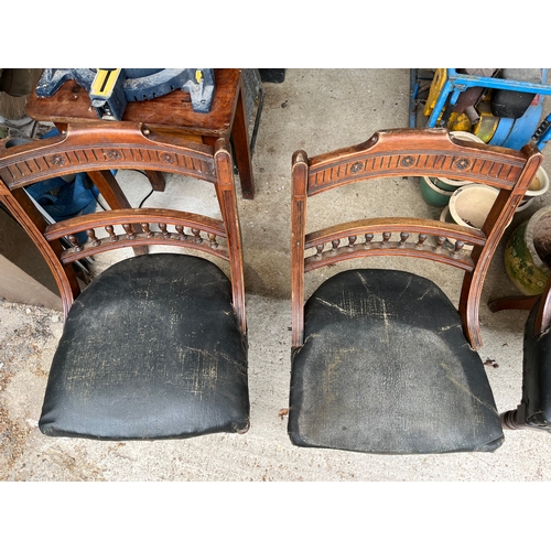 535 - Set of 4 rare Georgian carved chairs with front wheels and spring seats covered with leather.