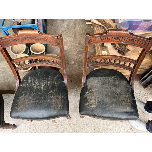 535 - Set of 4 rare Georgian carved chairs with front wheels and spring seats covered with leather.