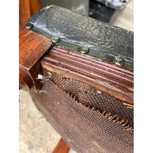 535 - Set of 4 rare Georgian carved chairs with front wheels and spring seats covered with leather.