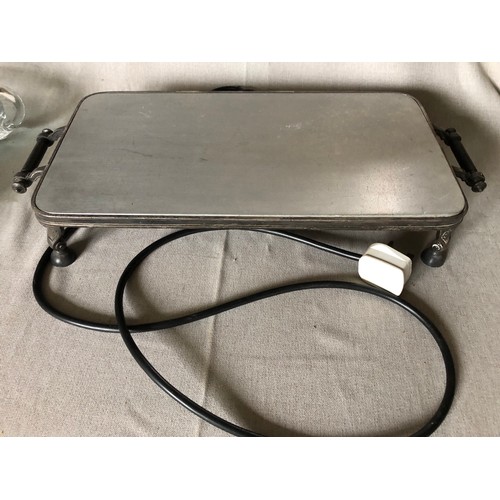 765 - Silver plated electric hot plate with aluminium surface and bakelite handles and feet