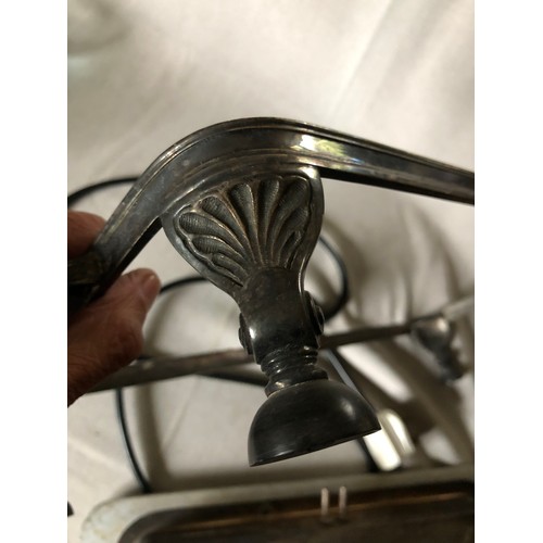 765 - Silver plated electric hot plate with aluminium surface and bakelite handles and feet