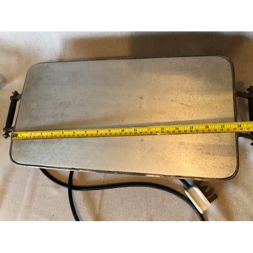 765 - Silver plated electric hot plate with aluminium surface and bakelite handles and feet