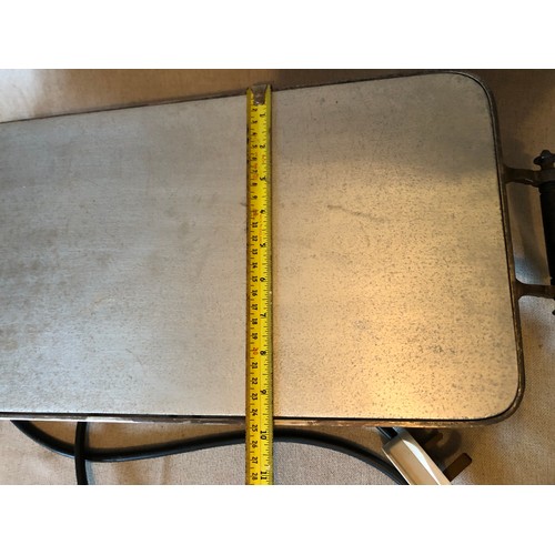 765 - Silver plated electric hot plate with aluminium surface and bakelite handles and feet