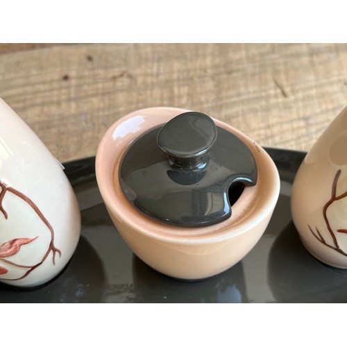 945 - Carltonware Austrian pattern cruet set.