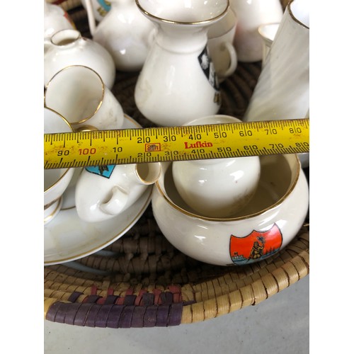 1060 - Basket of antique Goss posy vases etc.