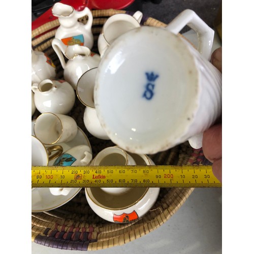 1060 - Basket of antique Goss posy vases etc.