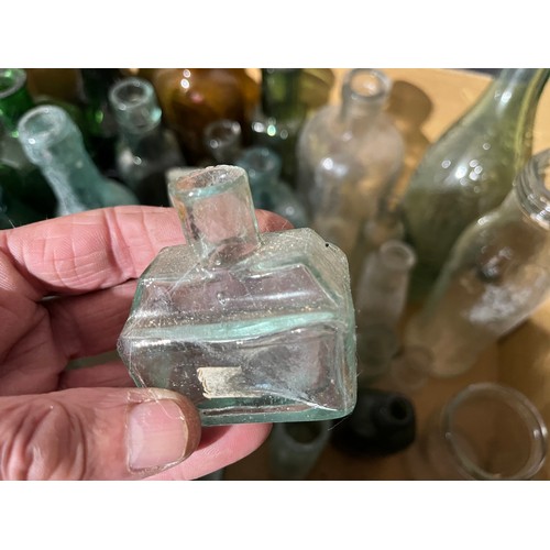 1066 - Collection of old glass bottles along with perfume bottles. Some named