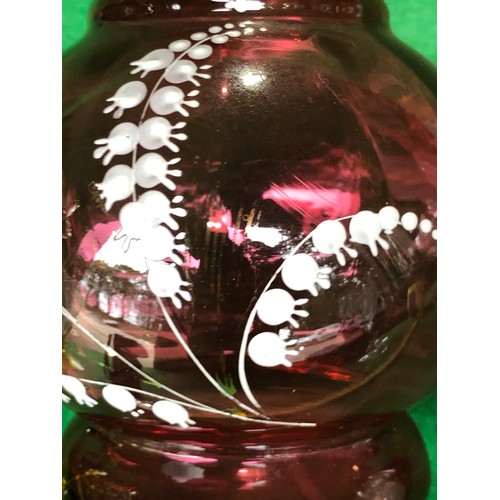 1113 - Cranberry glass vase decorated in lily-of-the-valley white enamel.