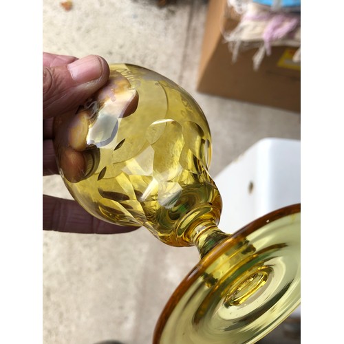 1115 - Five John Walsh vine and tendril wine glasses in Amber glass.