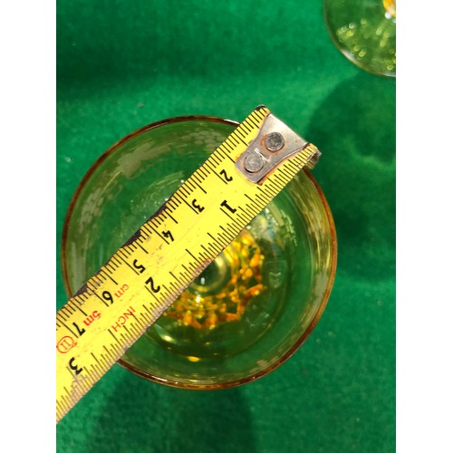 1115 - Five John Walsh vine and tendril wine glasses in Amber glass.