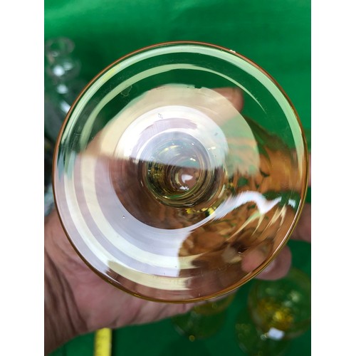 1115 - Five John Walsh vine and tendril wine glasses in Amber glass.