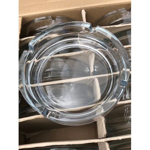 1129 - MOD -  2 boxes of new glass ashtrays. 12 per box.