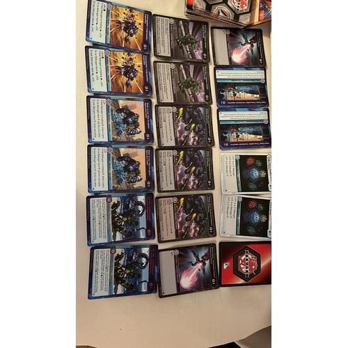 1376 - A large collection of Bakugan toys and cards. Very collectable